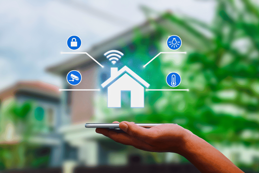 Hand holding a smartphone with a house icon and various smart home security icons hovering above it, including a lock, lightbulb & camera. All ways of securing windows and doors.