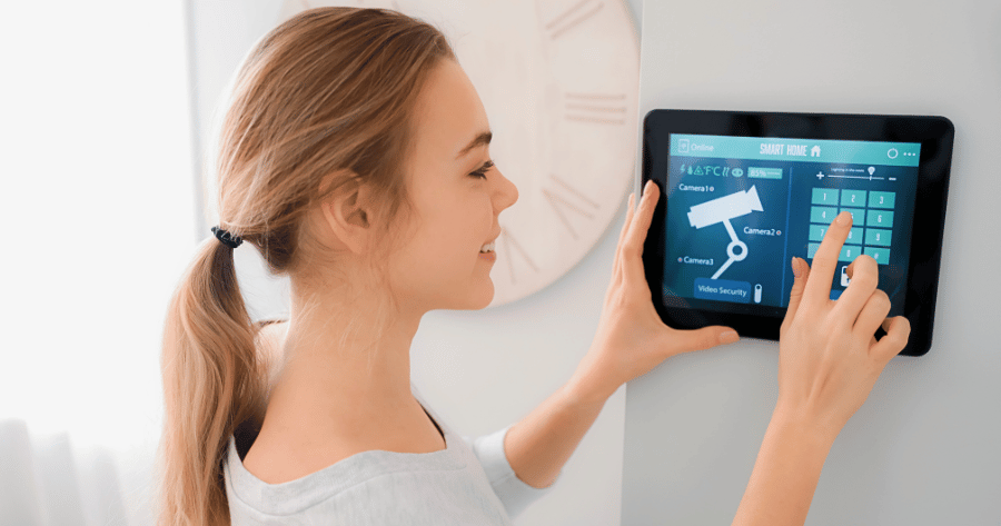 Homeowner checking the home security camera monitor display