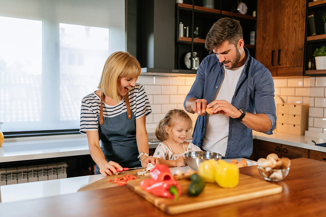 family-cooking-together-home-safe Family cooking together home safe
