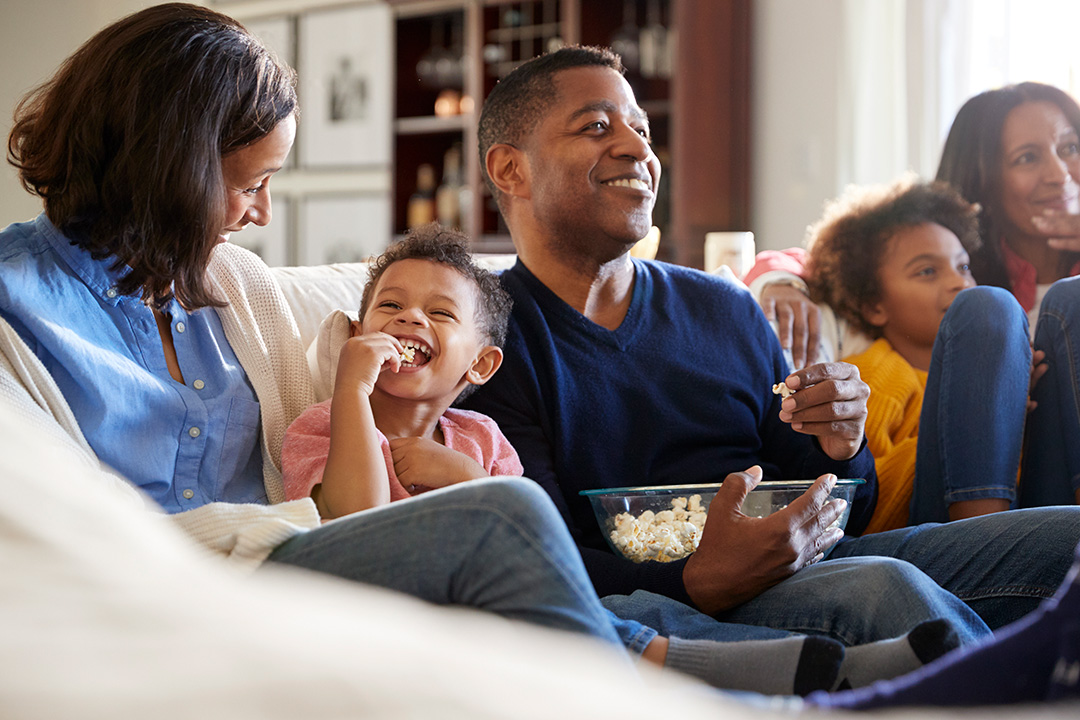 family-couch-smiling-safe-secure-happy Family couch smiling safe secure happy