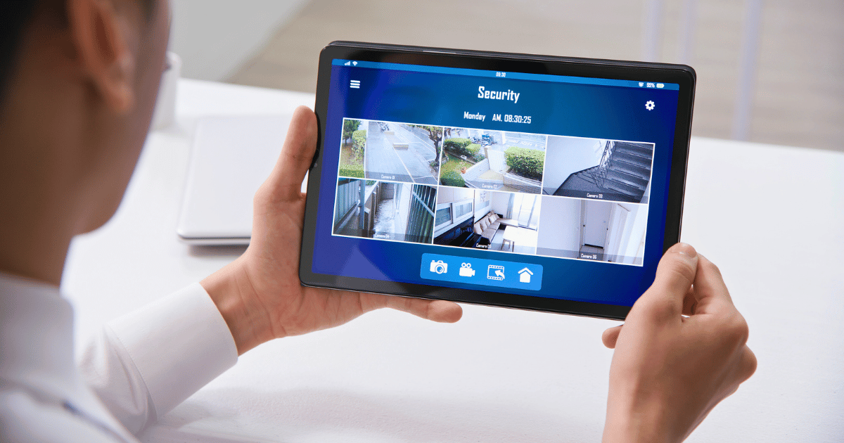 Woman checking her home security cameras on her ipad.
