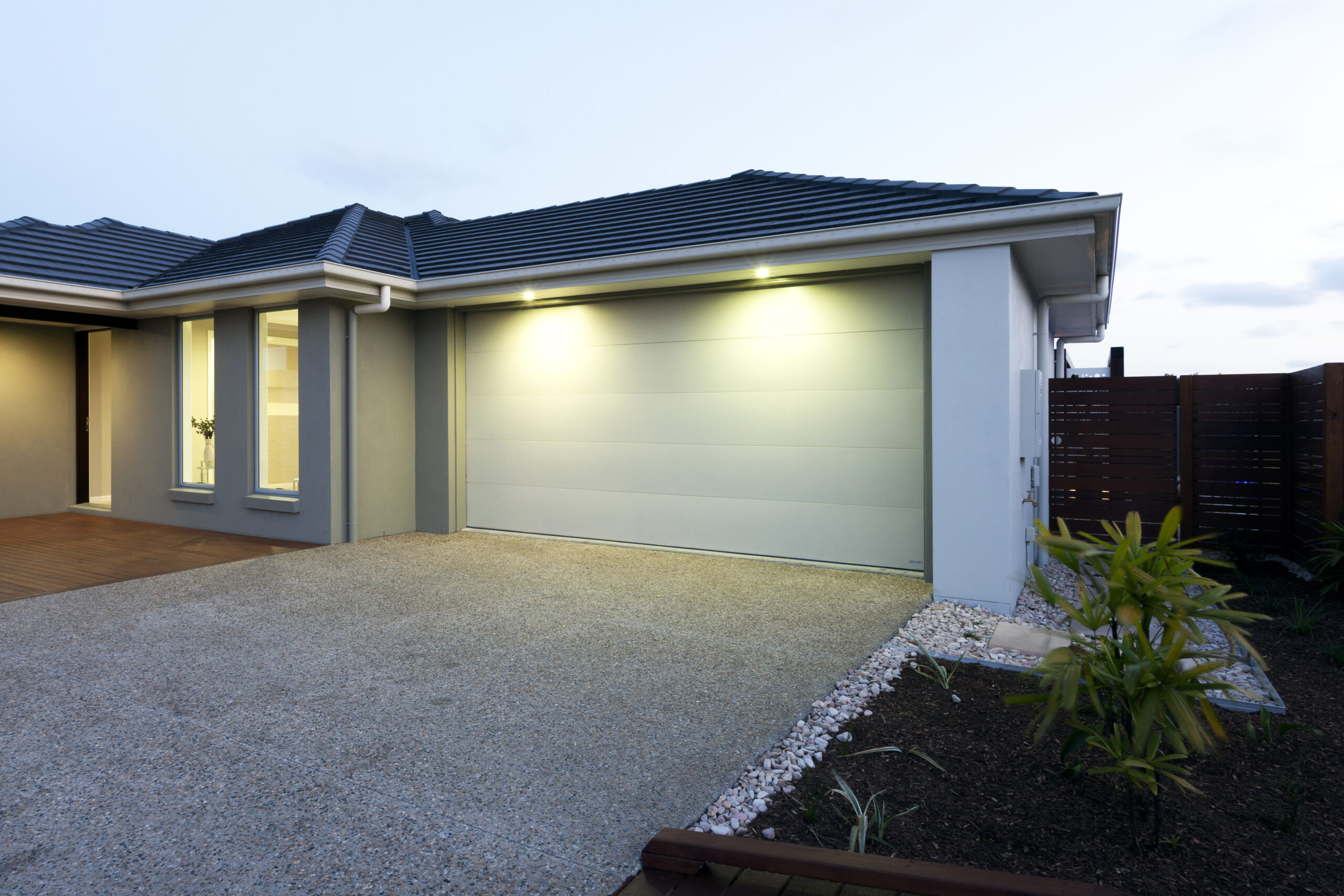 Fron view of a modern house with garage Home security systems indianapolis
