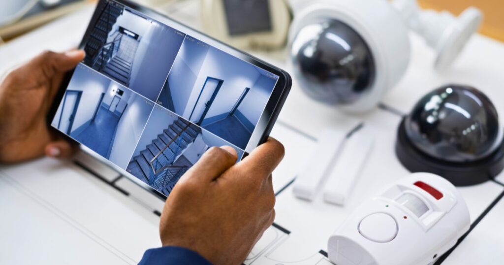 Tablet screen displaying a warehouse security system camera multi-feed